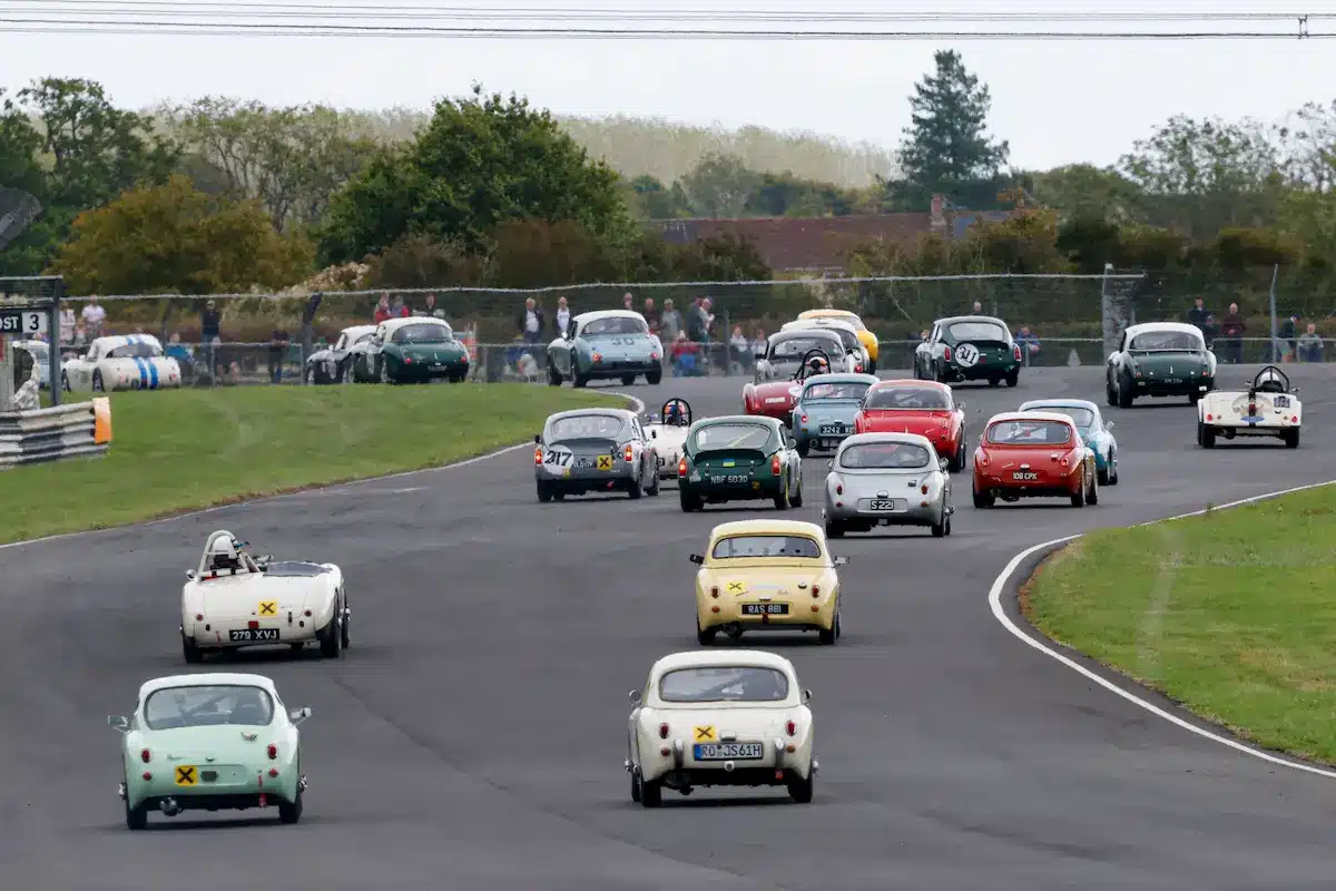 Austin-Healey Sprite number 217 racing at Castle Combe Circuit