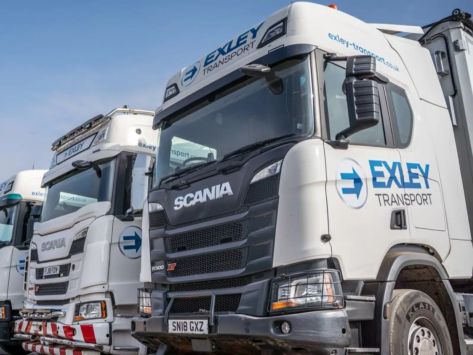 Row of liveried Scania tractor units