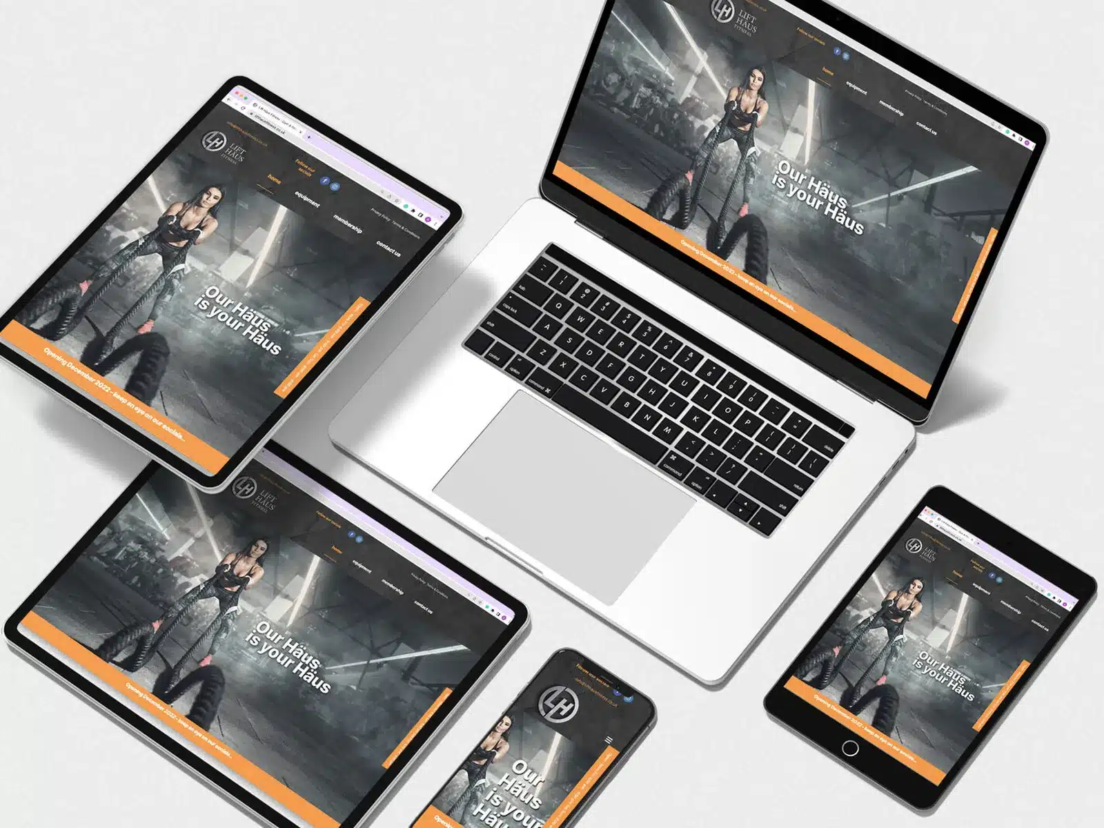 Race car workshop website design Race car workshop website across a laptop and tablets